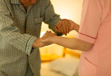 home care services - Senior man being cared by a female caregiver